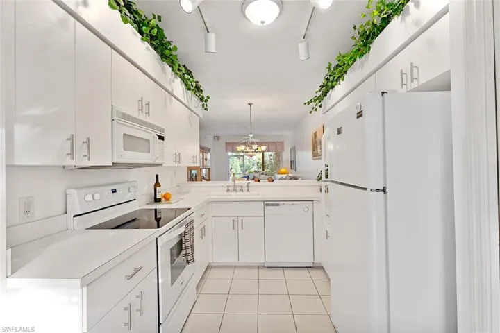 Open kitchen, with plethora of counter space & storage in cabinets & pantry. Stove 2023, dishwasher 2018.