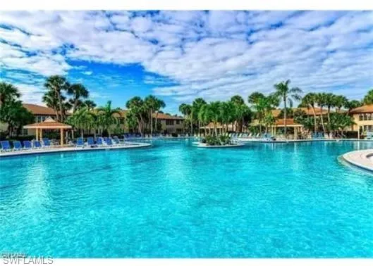 Community pool with a gazebo and a patio area