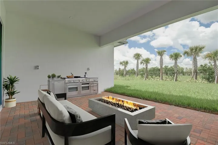 View of patio featuring an outdoor living space with a fire pit and exterior kitchen- digitally staged