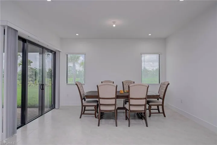 Dining space with plenty of natural light and recessed lighting