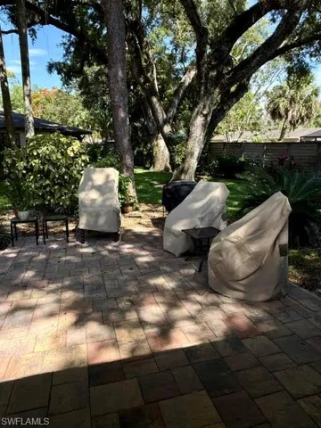 Expansive paver patio offering a spacious outdoor area