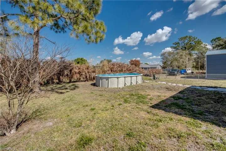 View of yard with an outdoor pool