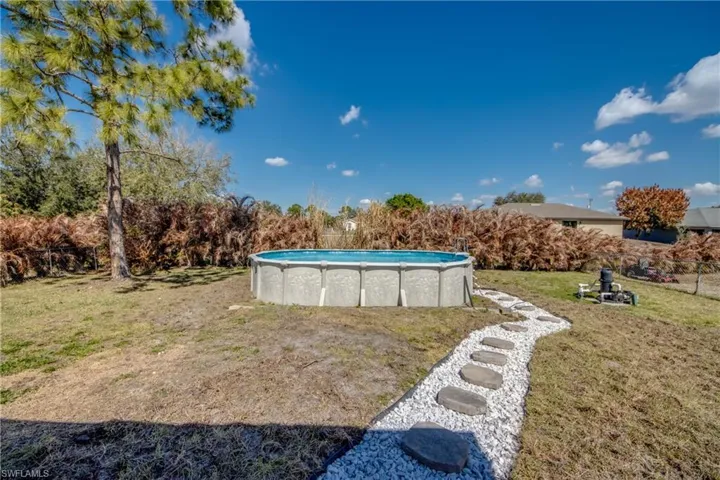 View of yard featuring an outdoor pool