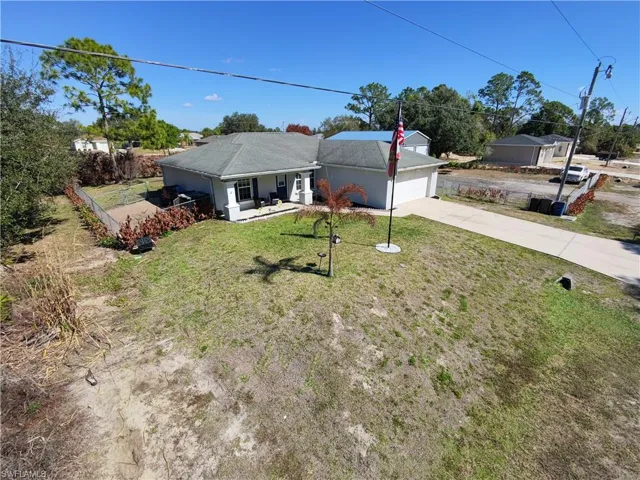 Single story home featuring driveway and a garage