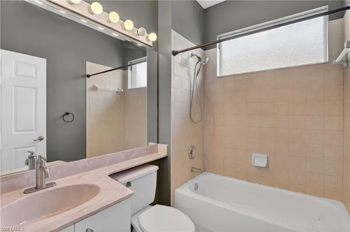 Full bath featuring vanity and tub / shower combination