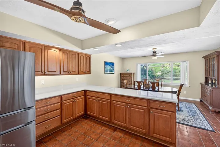 The kitchen flows into the dining area that overlooks the pool!