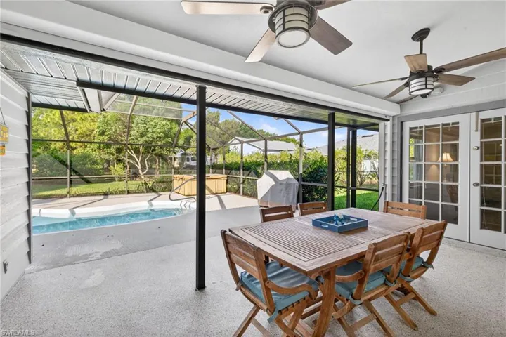Extend your entertaining area to the outdoor screened in lanai overlooking the pool. Automatic hurricane screen installed providing protection to this area.