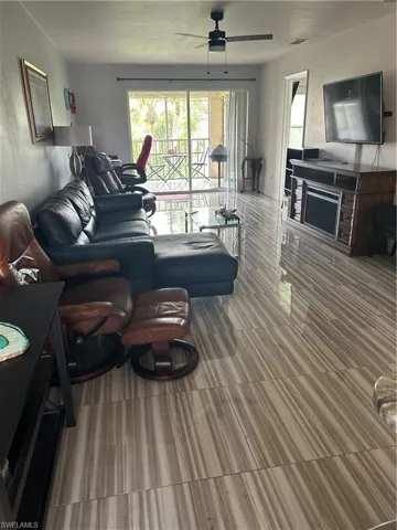 Living room featuring ceiling fan