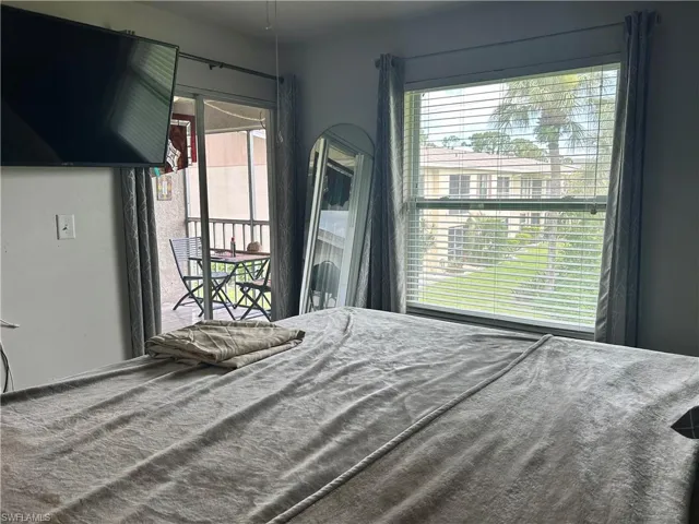 bedroom featuring multiple windows