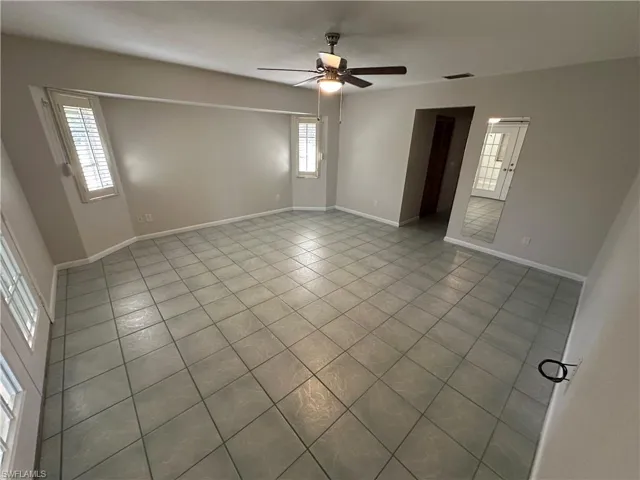 Primary bedroom with French Doors to Bonus Room and also door to Living Room.