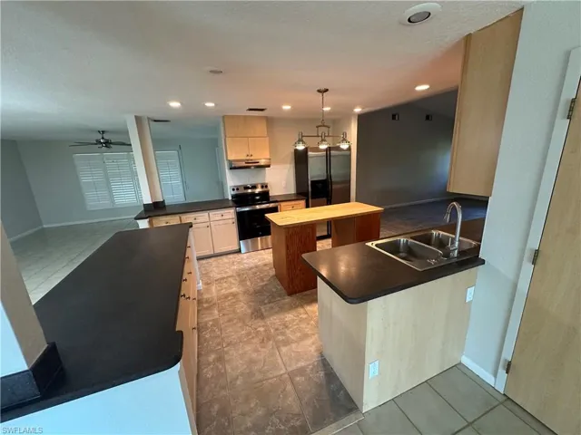 Kitchen with view of living room.