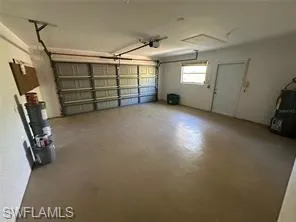 Garage featuring a garage door opener