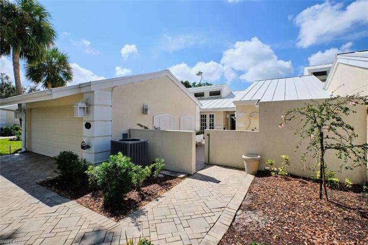 The brick paver walk way welcomes youto this 2 bedroom, 2 bath attached villa.