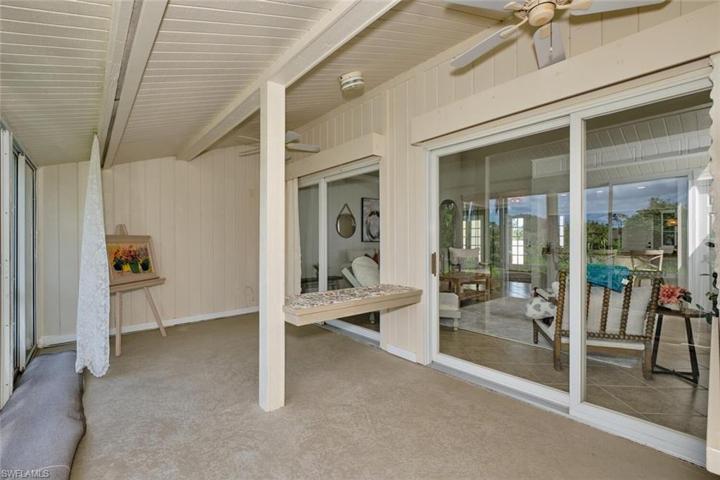 Glassed in patio has two sets of sliders from the great room.