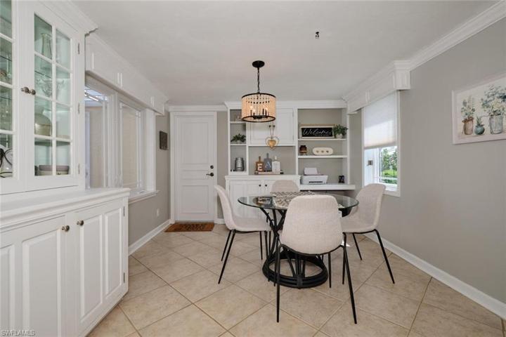 Breakfast area has built-in china cabinet and office work desk.