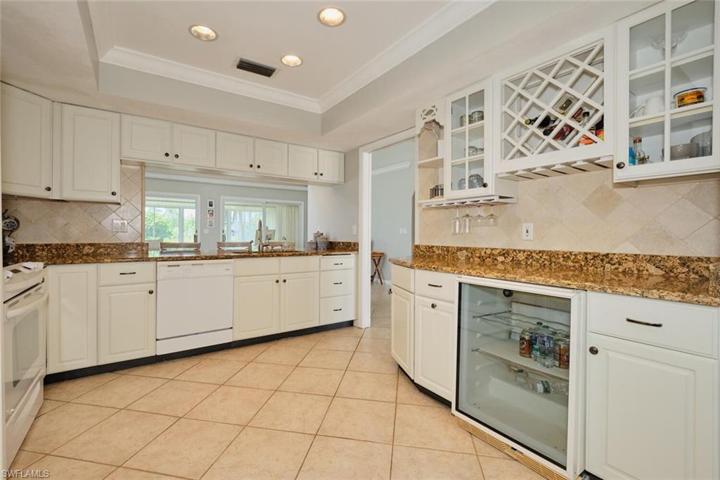Kitchen features a beverage center with wine cooler and wine rack.
