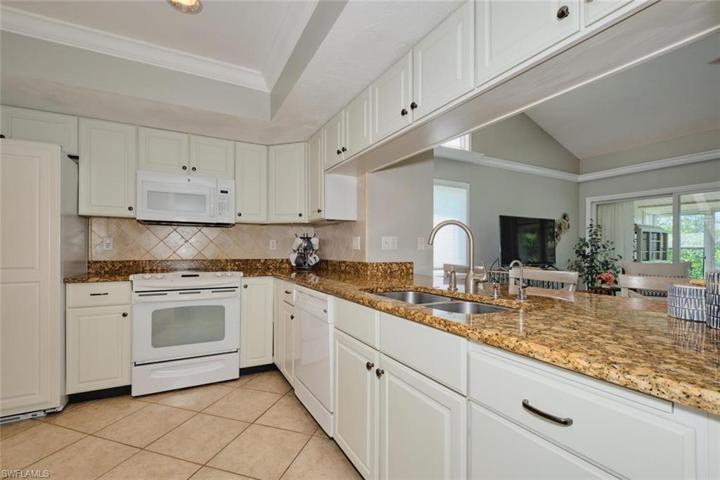 Kitchen has lots of cabinet and counter space.