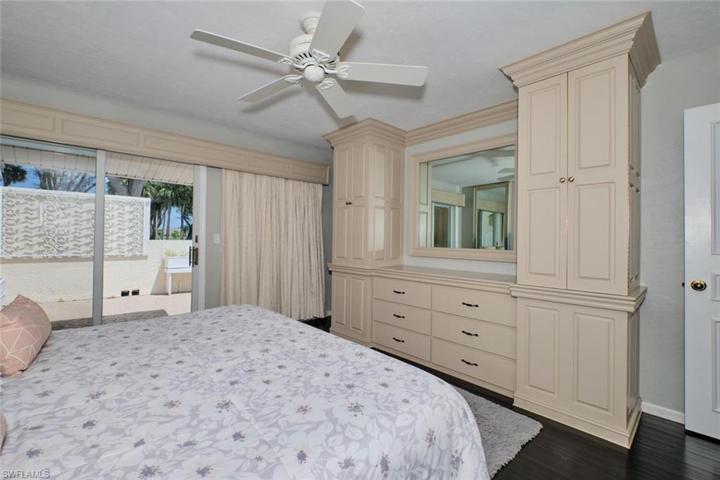 Guest bedroom has built-in storage cabinetry.