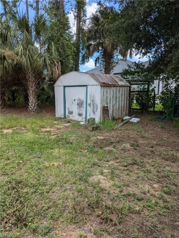 View of outdoor structure for extra storage.