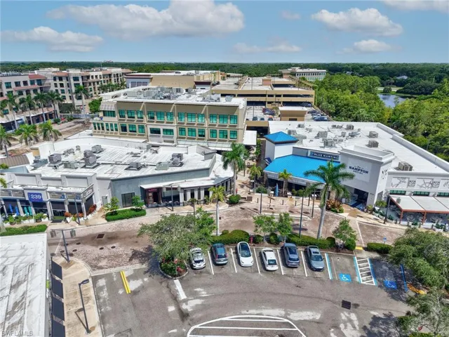 Aerial perspective showcasing a multi-story commercial complex with varied architectural styles