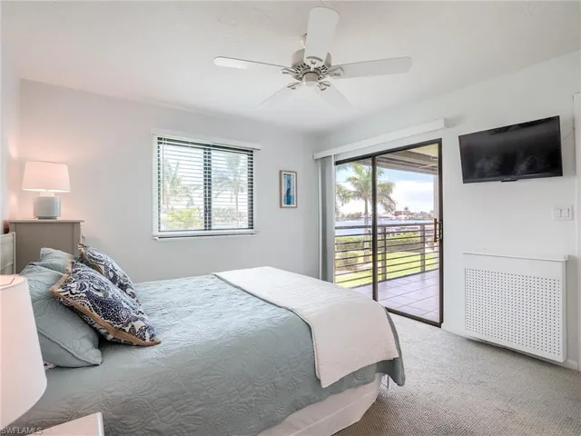 Sliders to the lanai from the primary bedroom