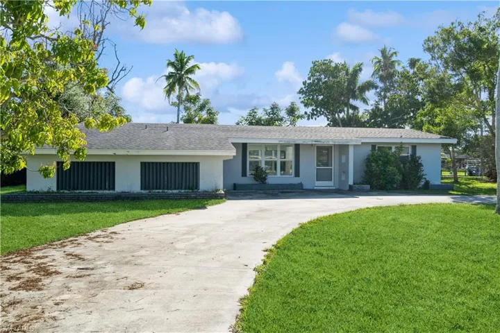 Front of property with circle drive