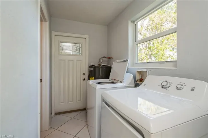 Inside laundry with new washer/dryer