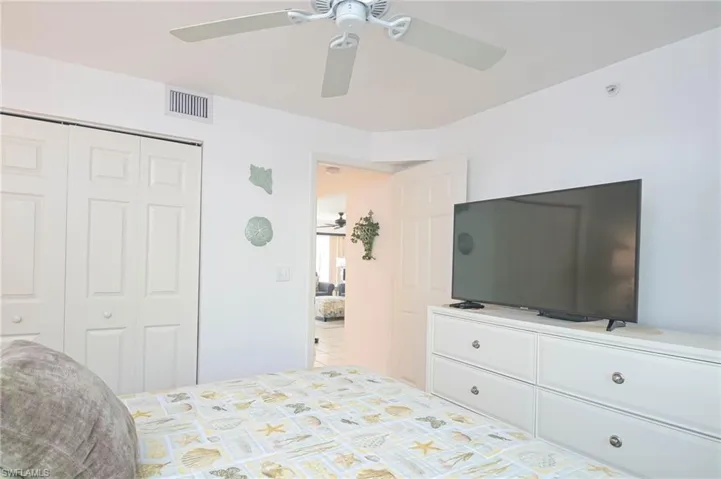 Bedroom featuring a closet and ceiling fan