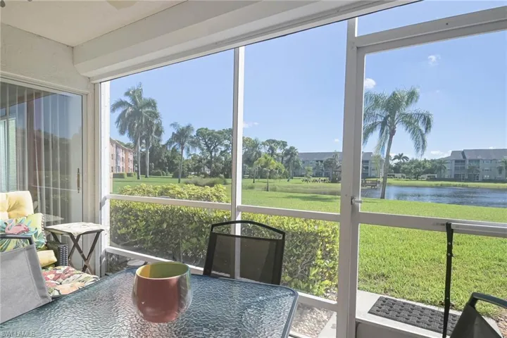 Sunroom / solarium featuring a water view and a wealth of natural light