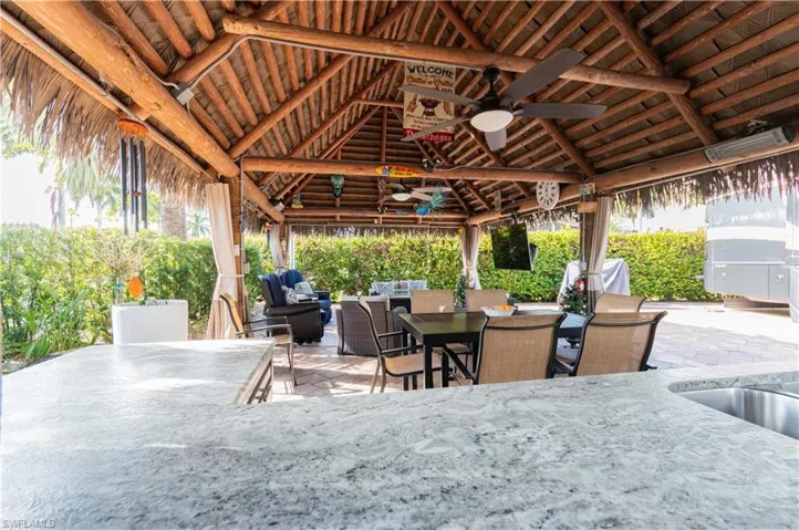 View of patio with ceiling fan, outdoor dining space, and outdoor lounge area