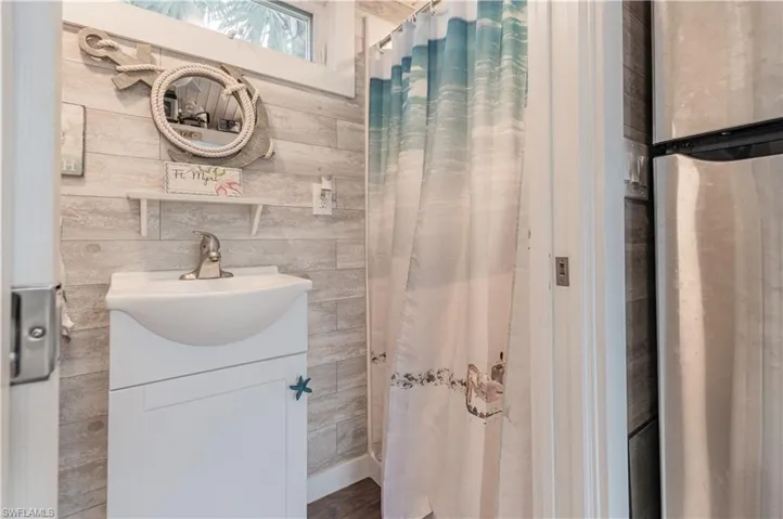 Bathroom featuring vanity and a shower with curtain
