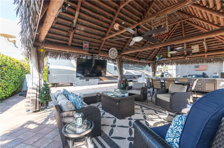View of patio / terrace featuring a ceiling fan, area for grilling, and outdoor lounge area