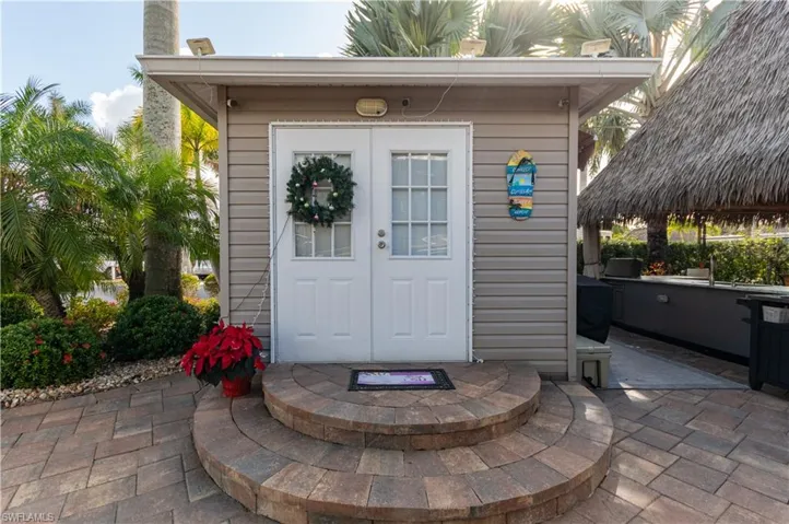 View of exterior entry featuring a patio area