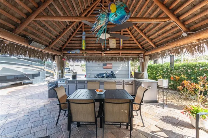 View of patio / terrace featuring area for grilling, a gazebo, and outdoor dining space