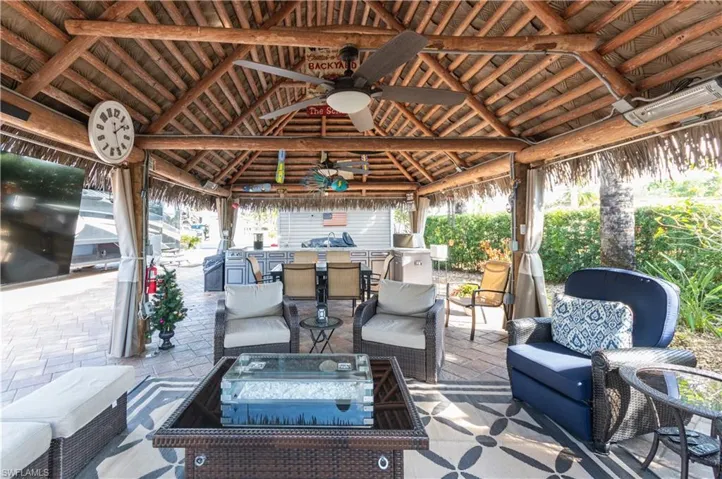 View of patio / terrace with ceiling fan and an outdoor living space