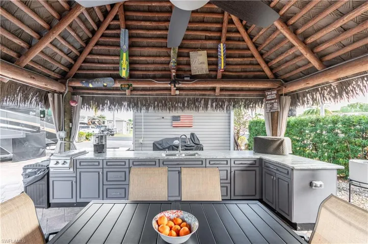 Deck featuring area for grilling, a gazebo, and a patio