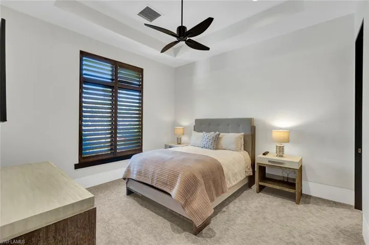 Guest bedroom #2 with trail ceiling and clean lines