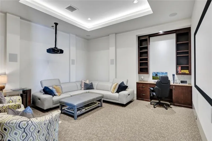 Spacious theatre room and built-in desk for second office space