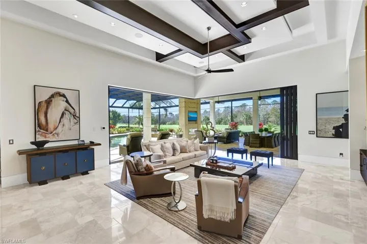 Lovely living room with exquisite ceiling wood detail.