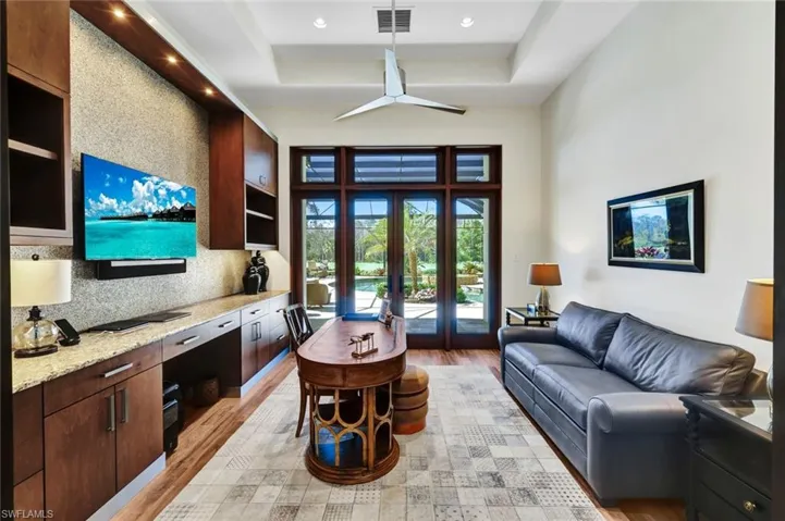 Office area with great built-in desk area and French doors leading to your resort style pool