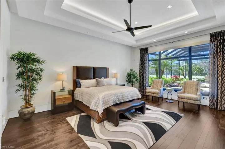 Primary bedroom overlooking the outdoor oasis