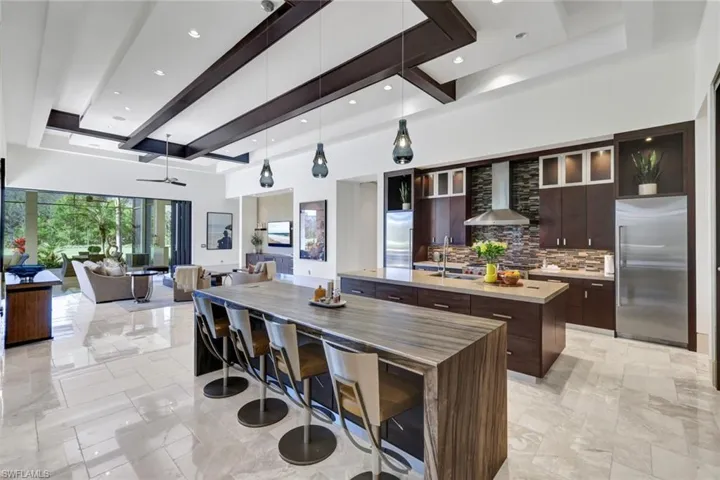 Clean and sleek lines of the kitchen overlooking the living room space