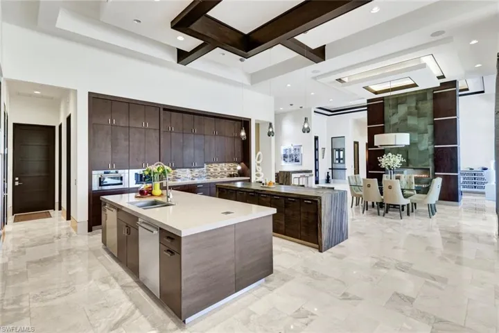 Gourmet kitchen with Wolf Appliances and built-in coffee maker