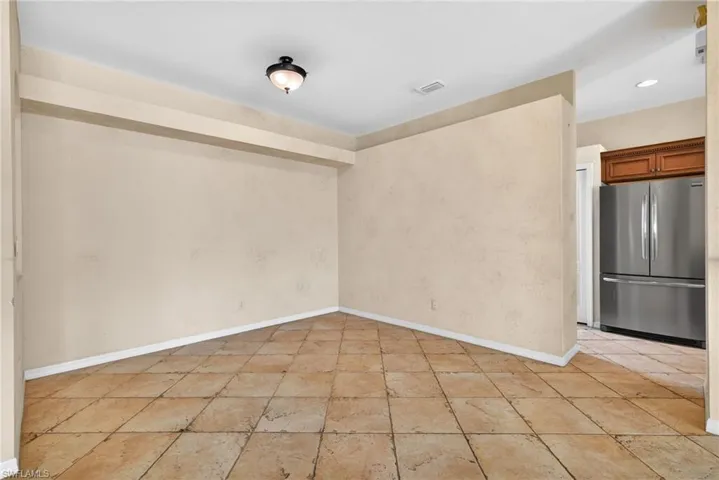 Unfurnished room with baseboards and recessed lighting
