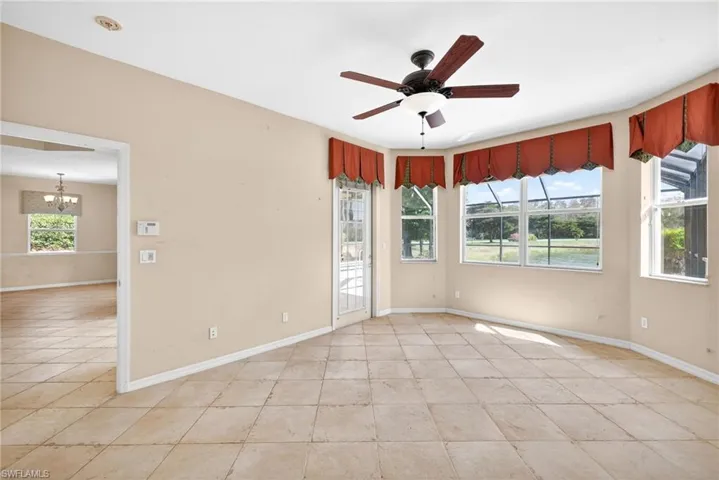 Spare room featuring ceiling fan and suspended lighting