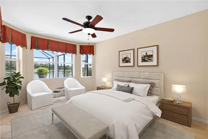 Bedroom featuring light tile patterned flooring, a water view, and ceiling fan