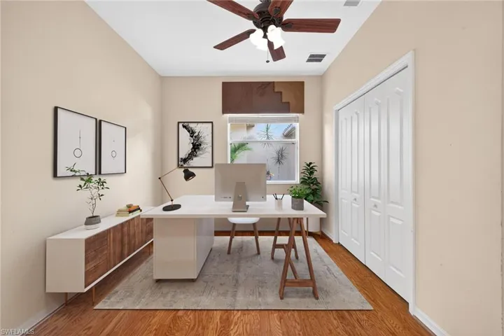 Office space featuring light wood-style floors and ceiling fan