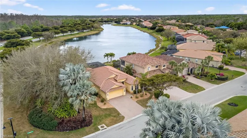 Aerial perspective of suburban area with a large body of water