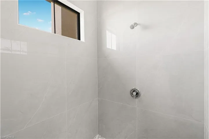 Bathroom with tiled shower