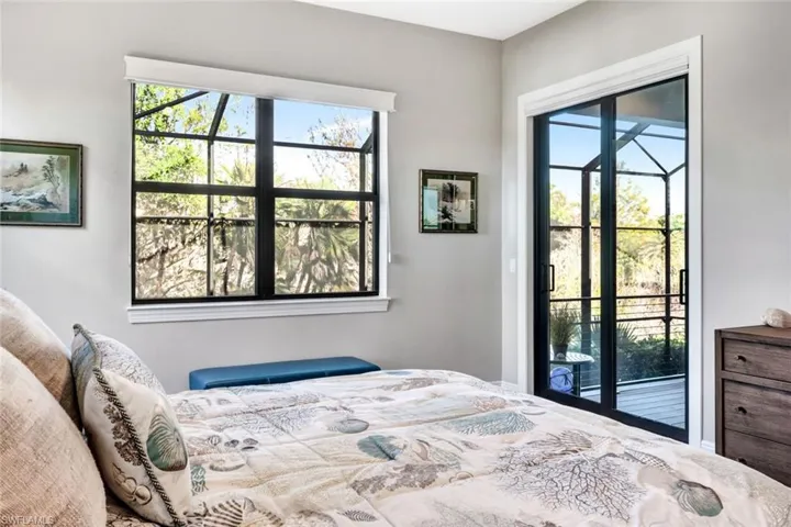 Master Bedroom with multiple windows and access to outside